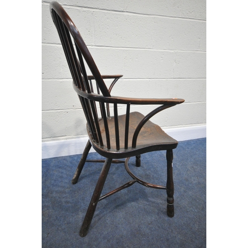 204 - A YEW WOOD WINDSOR HOOP BACK CHAIR, the spindles terminate to shaped armrests, an elm dished seat, r... 