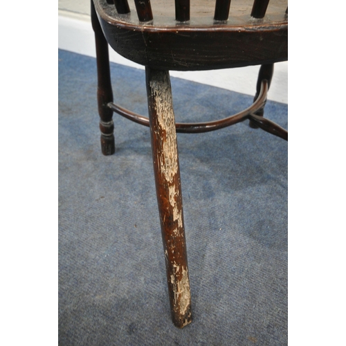 204 - A YEW WOOD WINDSOR HOOP BACK CHAIR, the spindles terminate to shaped armrests, an elm dished seat, r... 