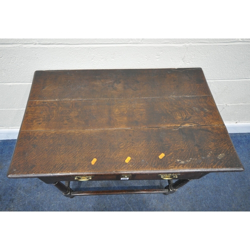 206 - A GEORGIAN OAK LOWBOY, with a single frieze drawer, raised on turned legs, united by stretchers, wid... 