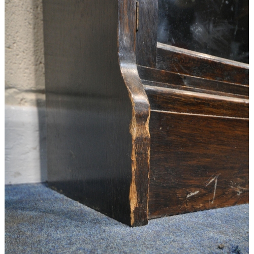 207 - W M BAKER AND CO, OXFORD, AN EARLY 20TH CENTURY OAK FOUR SECTION ELASTIC BOOKCASE, each section with... 