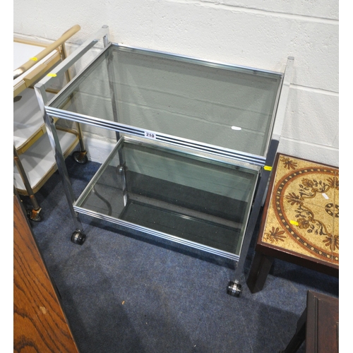 210 - A TUBULAR METAL TWO TIER TROLLEY, with glass inserts, width 66cm x depth 41cm x height 74cm, a pair ... 