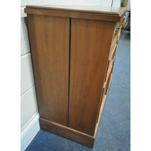 221 - A 20TH CENTURY SATINWOOD CABINET, with two drawers, over double cupboard doors, raised on castors, w... 