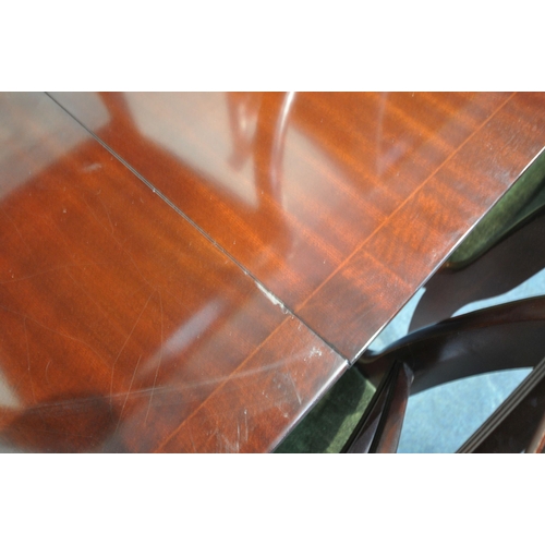 229 - A LATE 20TH CENTURY MAHOGANY OVAL EXTENDING DINING TABLE, with a single fold out leaf, extended leng... 