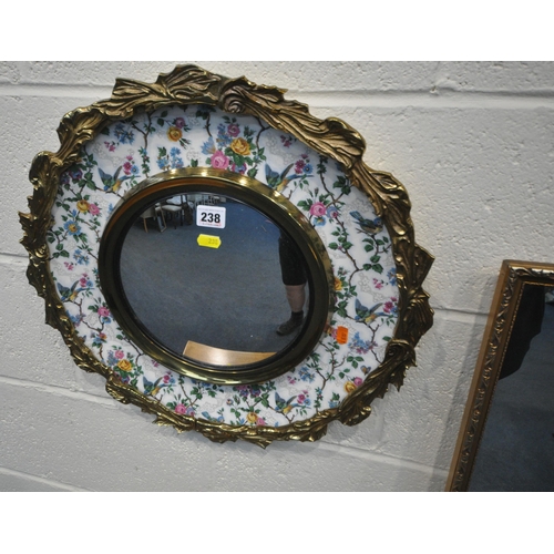 238 - A BURLEIGH WARE WALL MIRROR, with a metal outer ring, the ceramic dish with floral and bird details,... 