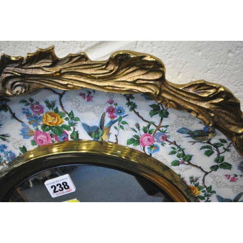 238 - A BURLEIGH WARE WALL MIRROR, with a metal outer ring, the ceramic dish with floral and bird details,... 