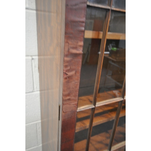 241 - A 20TH CENTURY MAHOGANY BOOKCASE, fitted with double glass doors, over double cupboard doors, width ... 