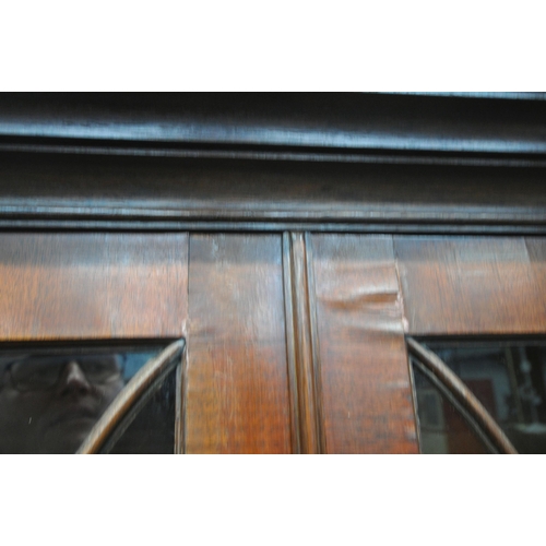 241 - A 20TH CENTURY MAHOGANY BOOKCASE, fitted with double glass doors, over double cupboard doors, width ... 