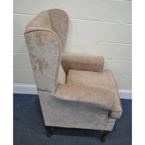 245 - A BEIGE UPHOLSTERED WINGBACK ARMCHAIR, width 75cm x depth 80cm x height 117cm, condition report: gen... 