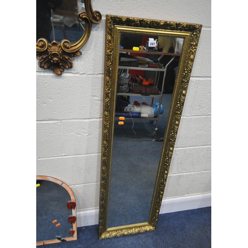 247 - A GILT FRAME RECTANGULAR WALL MIRROR, 131cm x 41cm, a foliate gilt frame wall mirror, along with two... 