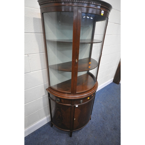 249 - A 20TH CENTURY MAHOGANY DEMI-LUNE DISPLAY CABINET, the top with a single glazed door, atop a base wi... 