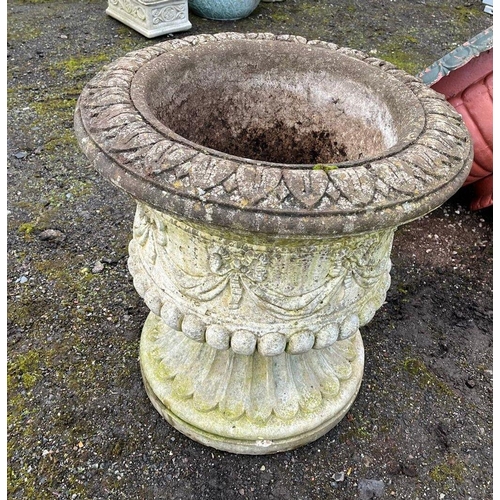 10 - A LARGE MODERN COMPOSITE GARDEN URN, with a rope and swag detail over fluting to bowl and a fluted b... 