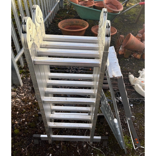 11 - AN ALUMINIUM FOLDING PLATFORM LADDER, with three loose platforms