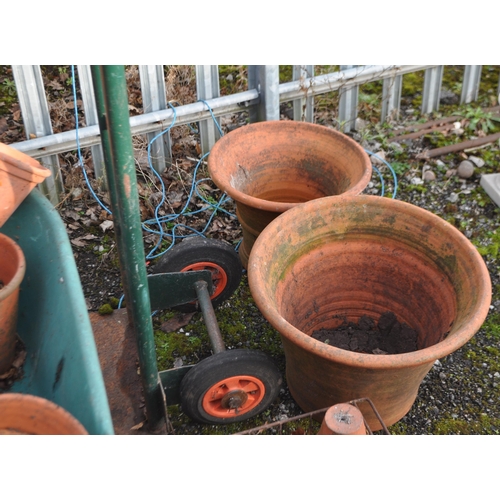 6 - A COLLECTION OF VINTAGE AND MODERN TERRACOTTA PLANT POTS,  the largest being 45cm in diameter, a whe... 