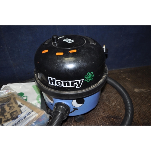 81 - A NUMATIC HVR-200A 'HENRY' VACUUM CLEANER with floor head and pipework along with spare bags, and a ... 