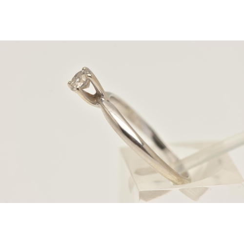 405 - A WHITE METAL DIAMOND SINGLE STONE RING, set with a round brilliant cut diamond in a raised claw set... 