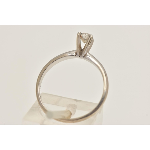 405 - A WHITE METAL DIAMOND SINGLE STONE RING, set with a round brilliant cut diamond in a raised claw set... 