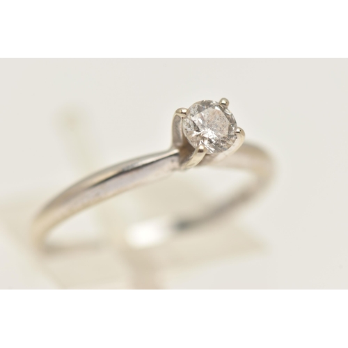 405 - A WHITE METAL DIAMOND SINGLE STONE RING, set with a round brilliant cut diamond in a raised claw set... 