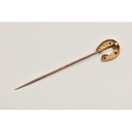 413 - A YELLOW METAL GEM SET, HORSESHOE STICK PIN, set with three circular cut rubies and three rose cut d... 