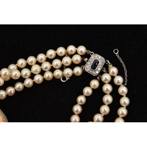 415 - A THREE STRAND CULTURED PEARL NECKLACE, three strands of individually knotted, graduated cream pearl... 