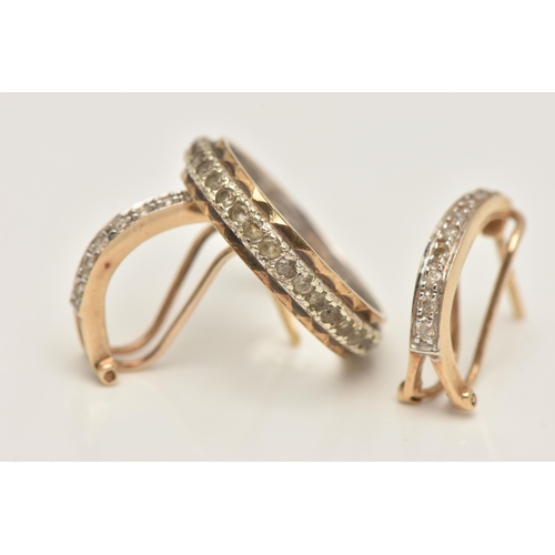 417 - AN ETERNITY RING AND PAIR OF EARRINGS, yellow and white metal full spinel set eternity ring, stamped... 