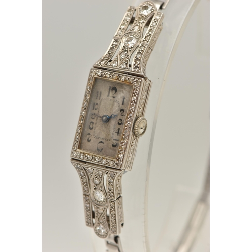 418 - A WHITE METAL DIAMOND SET COCKTAIL WATCH, manual wind, rectangular silvered dial (discoloured), Arab... 