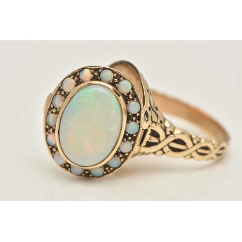 431 - AN OPAL CLUSTER RING, with locket component, set with an oval opal cabochon, surrounded by circular ... 