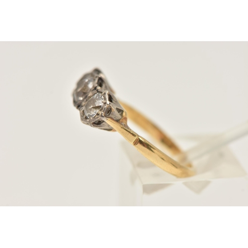 445 - A THREE STONE DIAMOND RING, three old cut diamonds, prong set in a white metal illusion setting, app... 