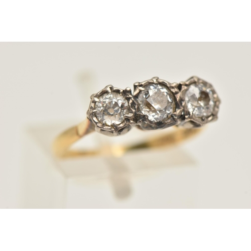 445 - A THREE STONE DIAMOND RING, three old cut diamonds, prong set in a white metal illusion setting, app... 