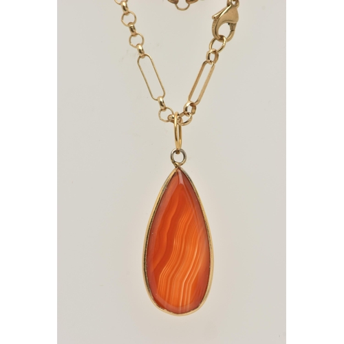 453 - A 9CT GOLD CARNELIAN PENDANT NECKLACE AND A RING, polished tear drop carnelian pendant collet set, f... 