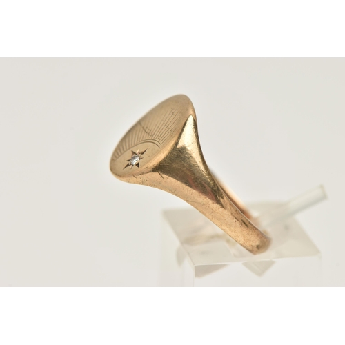 459 - A GENTS 9CT GOLD SIGNET RING, of an oval form, sunburst detail with a star set single cut diamond, t... 