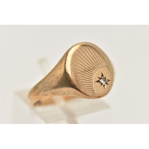 459 - A GENTS 9CT GOLD SIGNET RING, of an oval form, sunburst detail with a star set single cut diamond, t... 