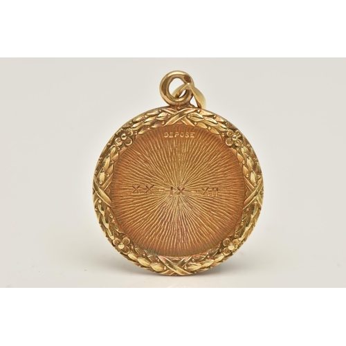 474 - AN 'ALPHONSE AUGIS' YELLOW METAL PENDANT, a circular form pendant with floral border detail, diamond... 