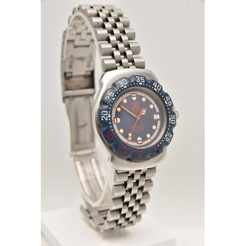 481 - A GENTS 'TAG HEUER' WRISTWATCH, quartz movement, round blue dial, spot markers, signed 'Tag Heuer Pr... 