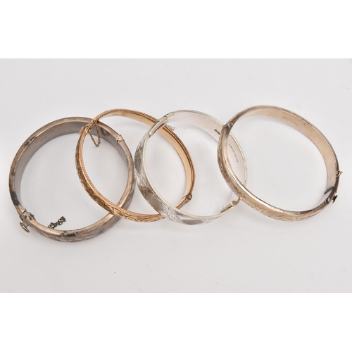 504 - THREE SILVER BANGLES AND A ROLLED GOLD BANGLE, three hinged bangles with etched detail, each hallmar... 