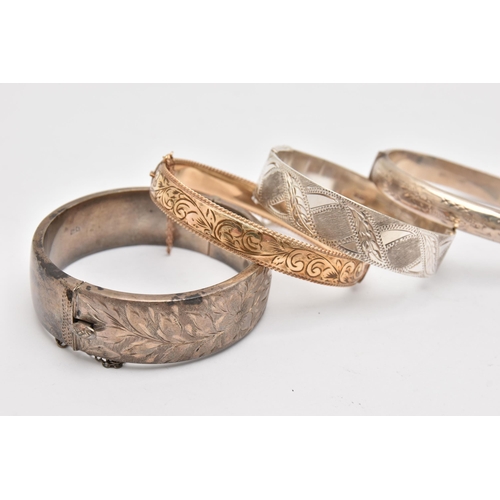 504 - THREE SILVER BANGLES AND A ROLLED GOLD BANGLE, three hinged bangles with etched detail, each hallmar... 