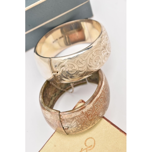 507 - TWO HINGED BANGLES, the first a silver bangle with box, foliate pattern with push button clasp and a... 