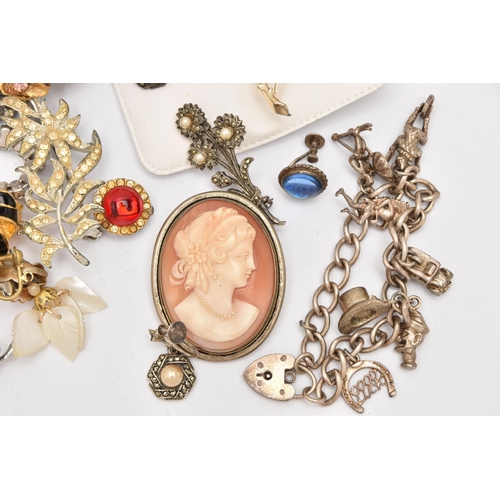 517 - AN ASSORTMENT OF WHITE METAL AND COSTUME JEWELLERY, to include a curb link bracelet fitted with a he... 