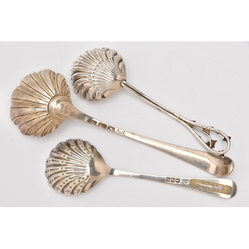 533 - AN ASSORTMENT OF SILVERWARE, to include a silver ladle with and two strainer spoons each with shell ... 