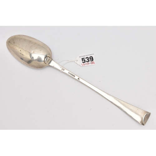 539 - A WHITE METAL BASTING SPOON, a large spoon with a tapered handle and scrolled terminal, monogram eng... 