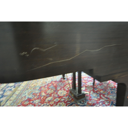 152 - A DANEMANN MAHOGANY CASED BABY GRAND PIANO, the hinged lid enclosing a cast iron over strung frame, ... 