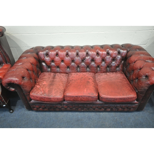 154 - A CHESTERFIELD OXBLOOD LEATHER BUTTON BACK THREE SEATER SOFA, length 190cm x depth 92cm x height 66c... 