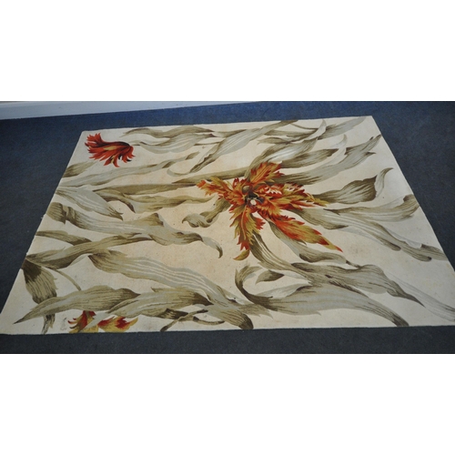 170 - A NOURISON TROPICS COLLECTION CREAM GROUND RECTANGULAR WOOLEN RUG, with large foliate patterns, 251c... 