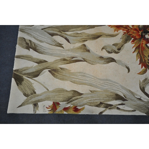 170 - A NOURISON TROPICS COLLECTION CREAM GROUND RECTANGULAR WOOLEN RUG, with large foliate patterns, 251c... 