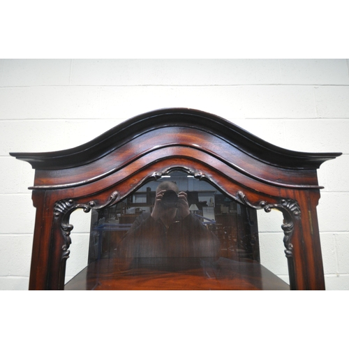 172 - A REPRODUCTION MAHOGANY DISPLAY CABINET, with an arched top, the single door enclosing two adjustabl... 