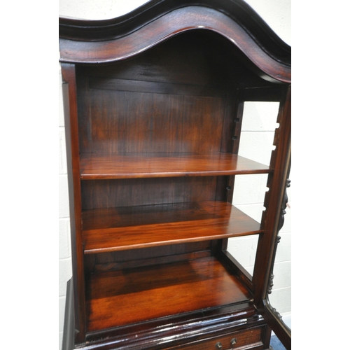 172 - A REPRODUCTION MAHOGANY DISPLAY CABINET, with an arched top, the single door enclosing two adjustabl... 