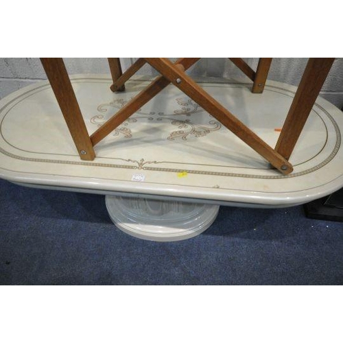 179 - A CREAM OVAL COFFEE TABLE, on a pedestal base, length 121cm x depth 61cm x height 46cm, a folding ch... 