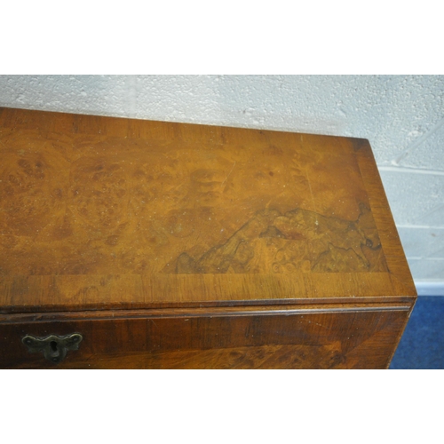 186 - A 20TH CENTURY WALNUT BUREAU, the fall front door enclosing a fitted interior, above four drawers, r... 