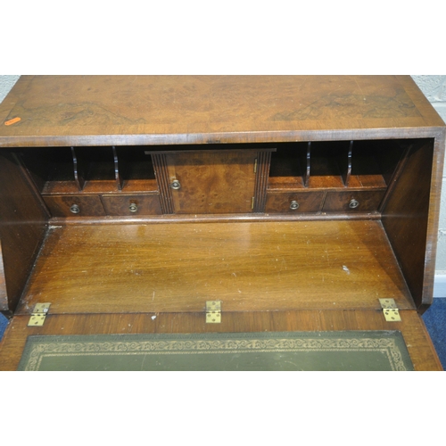 186 - A 20TH CENTURY WALNUT BUREAU, the fall front door enclosing a fitted interior, above four drawers, r... 