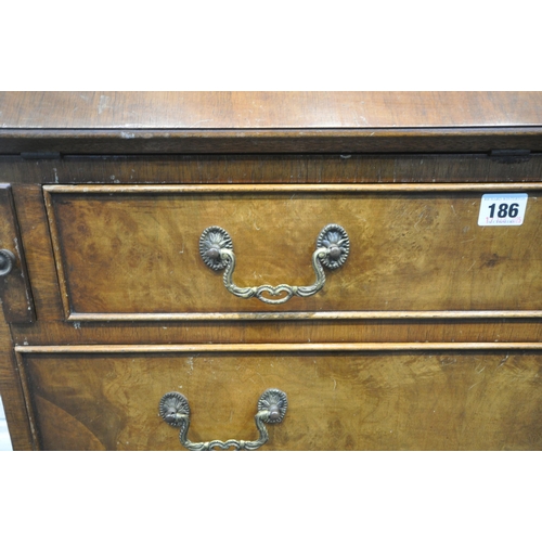 186 - A 20TH CENTURY WALNUT BUREAU, the fall front door enclosing a fitted interior, above four drawers, r... 