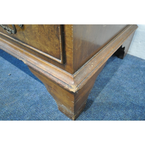 186 - A 20TH CENTURY WALNUT BUREAU, the fall front door enclosing a fitted interior, above four drawers, r... 